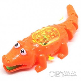 Велика заводна іграшка у вигляді крокодила. Заводиться за допомогою ключика збок. . фото 1