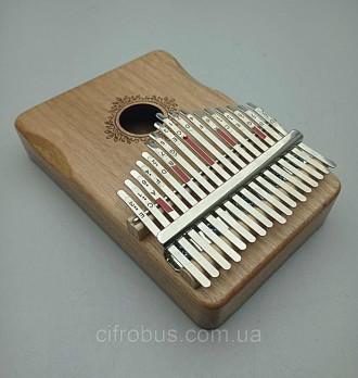 Металлические клавиши калимбы закреплены на корпусе из массива дерева, который в. . фото 4