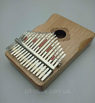 Металлические клавиши калимбы закреплены на корпусе из массива дерева, который в. . фото 5