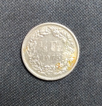 Страна:	Швейцария
Номинал: ½ франка
Год:	1975
Период: Швейцарская конф. . фото 2