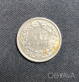 Страна:	Швейцария
Номинал: ½ франка
Год:	1975
Период: Швейцарская конф. . фото 1