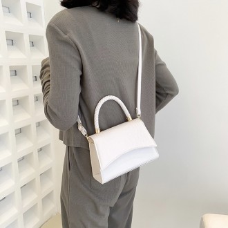 
Женская сумочка в стиле рептилии
Сумка кросс-боди на ремешке в стиле крокодилов. . фото 5