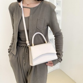 
Женская сумочка в стиле рептилии
Сумка кросс-боди на ремешке в стиле крокодилов. . фото 7