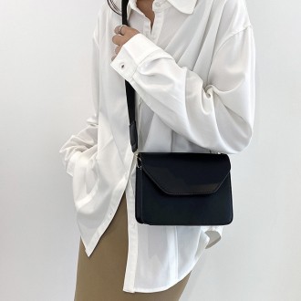 
ВИДЕООБЗОР
Женская классическая сумочка
Клатч на широком ремешке на одно отделе. . фото 4