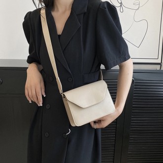 
ВИДЕООБЗОР
Женская классическая сумочка
Клатч на широком ремешке на одно отделе. . фото 8