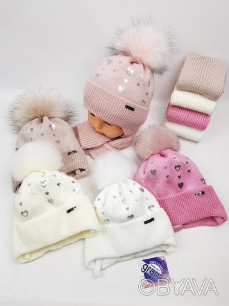 Дитячі польські зимові в'язані шапки на флісі з зав'язками і помпоном оптом для . . фото 1