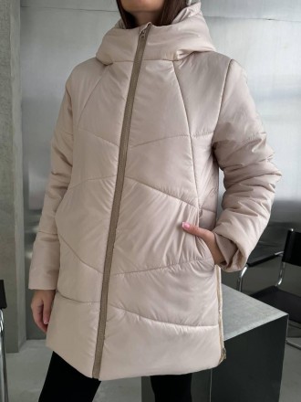 
Женская зимняя куртка средней длины с капюшоном.
Код 016953
Куртка стеганая с к. . фото 9