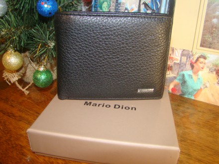 Чудовий гаманець з натуральної шкіри на магнітній застібці чорного кольору.
З н. . фото 2