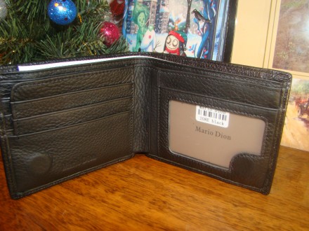 Чудовий гаманець з натуральної шкіри на магнітній застібці чорного кольору.
З н. . фото 4