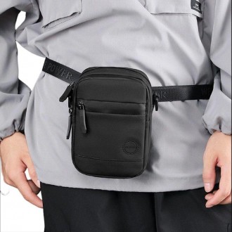 Чоловіча маленька компактна сумка через плече, на пояс тканинна чорна.
Розмір: 1. . фото 3