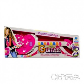 Яркая музыкальная игрушка - гитара в форме сердечка. Имеет несколько режимов игр. . фото 1