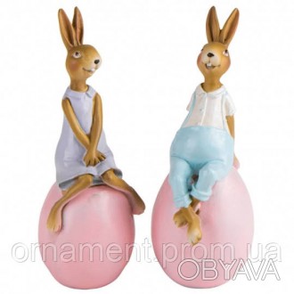 Статуетка кроликів — це фігурка з полістоуну, що зображує трьох грайливих кролик. . фото 1
