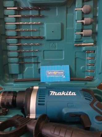 Опис:
Ударний дриль Makita HP1630 - це професійний інструмент, модель ідеально п. . фото 7