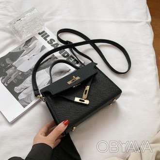 
Женская сумочка на одно отделение, фурнитура золотого цвета
Параметры - высота . . фото 1
