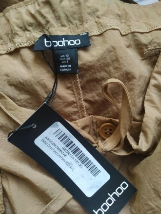 Об'ємні жіночі штани Booboo 8 розмір

В поясі шнурок функціональний
В по. . фото 4