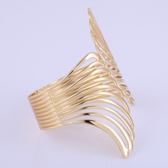 Широкий та жорсткий браслет виготовлений із високоякісного золотистого ювелірног. . фото 6