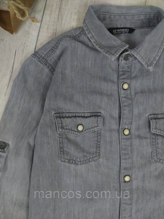 Рубашка джинсовая серая с застёжкой на кнопках, два кармана.
Состояние б/у, в оч. . фото 3