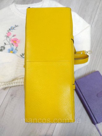 Изысканная кожаная жёлтая сумка придаст вашему образу свежий и стильный вид. Она. . фото 6