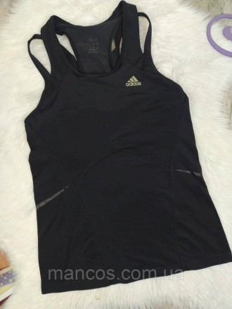 Энергичный стиль и комфорт объединяются в этой женской спортивной майке от Adida. . фото 3