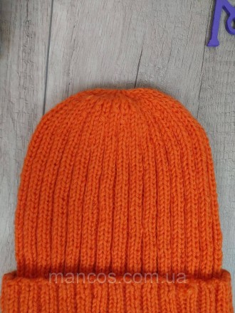 Теплая зимняя шапка в ярком оранжевом цвете станет отличным акцентом вашего зимн. . фото 3