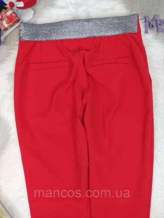Женские красные брюки б/у. Сзади пояс серебристого цвета. Имеются два кармана сз. . фото 6