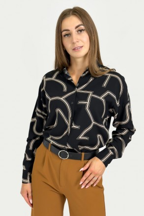 
Женская рубашка с абстрактным узором выполнена из качественной ткани. Спущенное. . фото 3