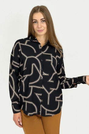 
Женская рубашка с абстрактным узором выполнена из качественной ткани. Спущенное. . фото 2