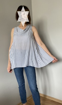 
Женская расклешённая лёгкая блузка в вертикальную полоску удлинённая с лёгким в. . фото 3
