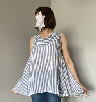 
Женская расклешённая лёгкая блузка в вертикальную полоску удлинённая с лёгким в. . фото 1
