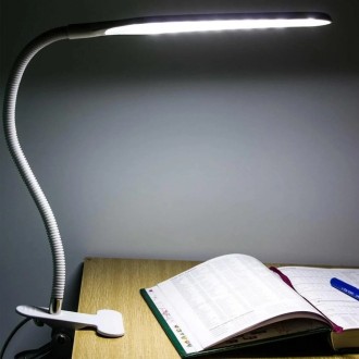Опис:
Настільна світлодіодна LED-лампа-прищіпка зроблена в оригінальному мінімал. . фото 10