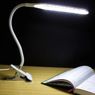 Опис:
Настільна світлодіодна LED-лампа-прищіпка зроблена в оригінальному мінімал. . фото 2