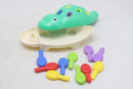 Пластиковая игрушка в виде динозавра. Состоит из 2 частей, который необходимо со. . фото 4
