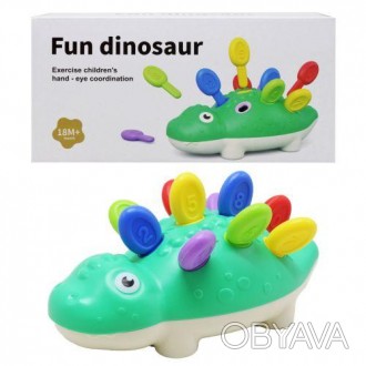 Пластиковая игрушка в виде динозавра. Состоит из 2 частей, который необходимо со. . фото 1