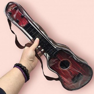 Чотириструнна гітара (укулеле), маленький дублікат справжнього інструменту. Має . . фото 3