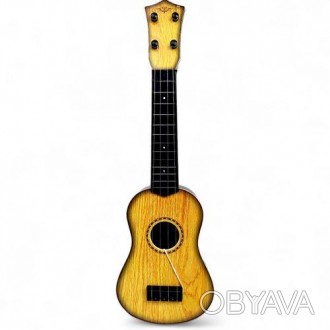 Четырехструнная гитара (укулеле), маленький дубликат настоящего инструмента. Име. . фото 1