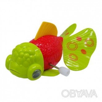 Яркая заводная игрушка в виде рыбки. Чтобы запустить игрушку, нужно провернуть к. . фото 1