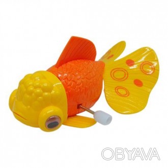 Яркая заводная игрушка в виде рыбки. Чтобы запустить игрушку, нужно провернуть к. . фото 1