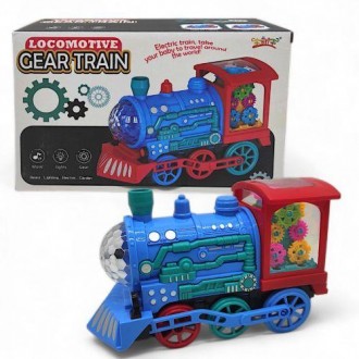Яркая интерактивная игрушка в виде локомотива поезда. Внутри игрушки размещены р. . фото 2