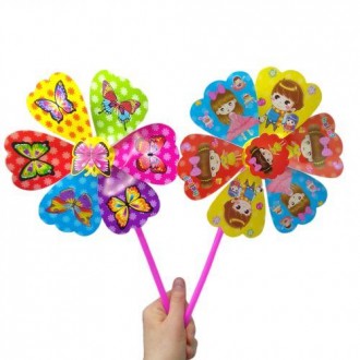 Яскрава іграшка-вітрячок. Іграшка складається з основи у вигляді квіточки-вертуш. . фото 2