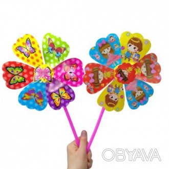 Яскрава іграшка-вітрячок. Іграшка складається з основи у вигляді квіточки-вертуш. . фото 1