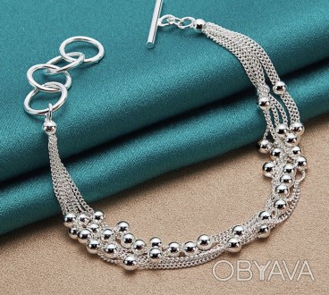 Жіночий браслет зі срібла з родієвим покриттям складається з шести ланцюжків та . . фото 1