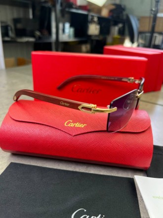 
 
 Солнцезащитные очки Cartier с деревянными дужками и синими стеклами
Производ. . фото 5