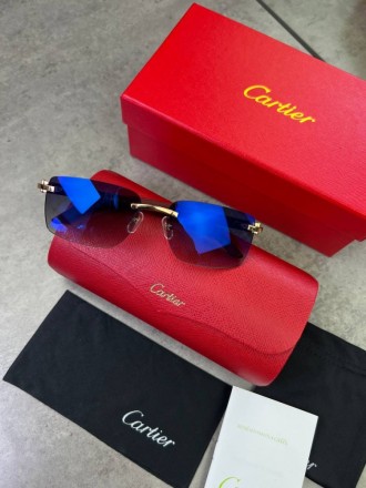 
 
 Солнцезащитные очки Cartier с деревянными дужками и синими стеклами
Производ. . фото 2