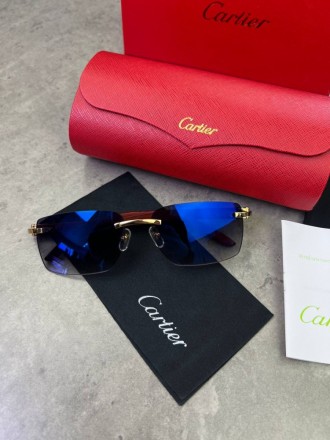 
 
 Солнцезащитные очки Cartier с деревянными дужками и синими стеклами
Производ. . фото 3
