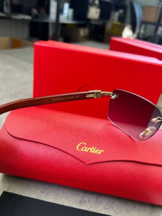 
 
 Солнцезащитные очки Cartier с деревянными дужками и синими стеклами
Производ. . фото 9