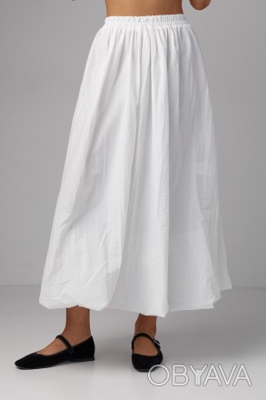 Длинная женская юбка с расширенным фасоном - это элегантный и женственный элемен. . фото 1
