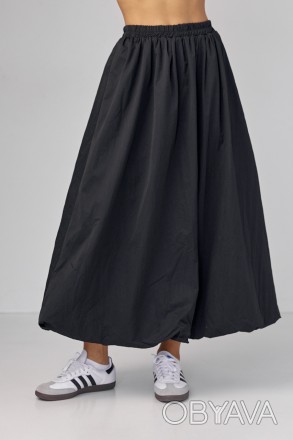 Длинная женская юбка с расширенным фасоном - это элегантный и женственный элемен. . фото 1