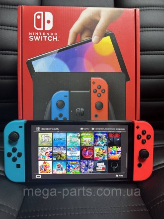 Портативна ігрова приставка Nintendo Switch OLED with Neon Blue and Neon Red Joy. . фото 2