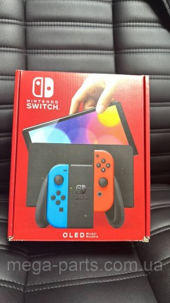 Портативна ігрова приставка Nintendo Switch OLED with Neon Blue and Neon Red Joy. . фото 8