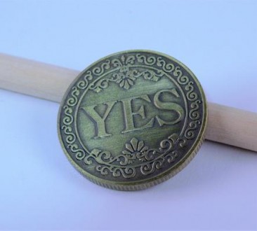 Монета сувенирная "YES NO"(цвет - бронза). Диаметр монеты 2,50 см., толщина 0,20. . фото 2
